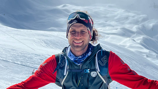 Noah Dines smiling on a mountain after reaching 1 million feet