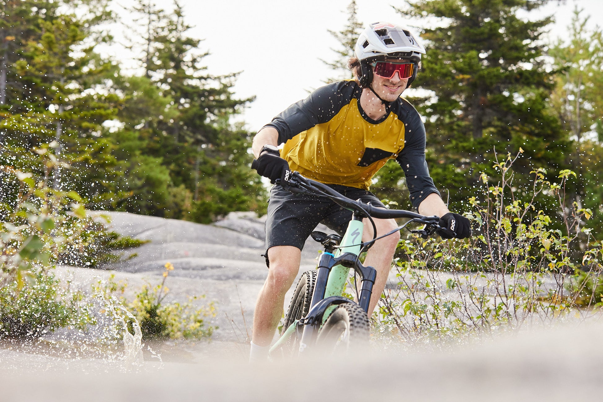 man wearing uvex sportstyle 235 sunglasses while mountain biking
