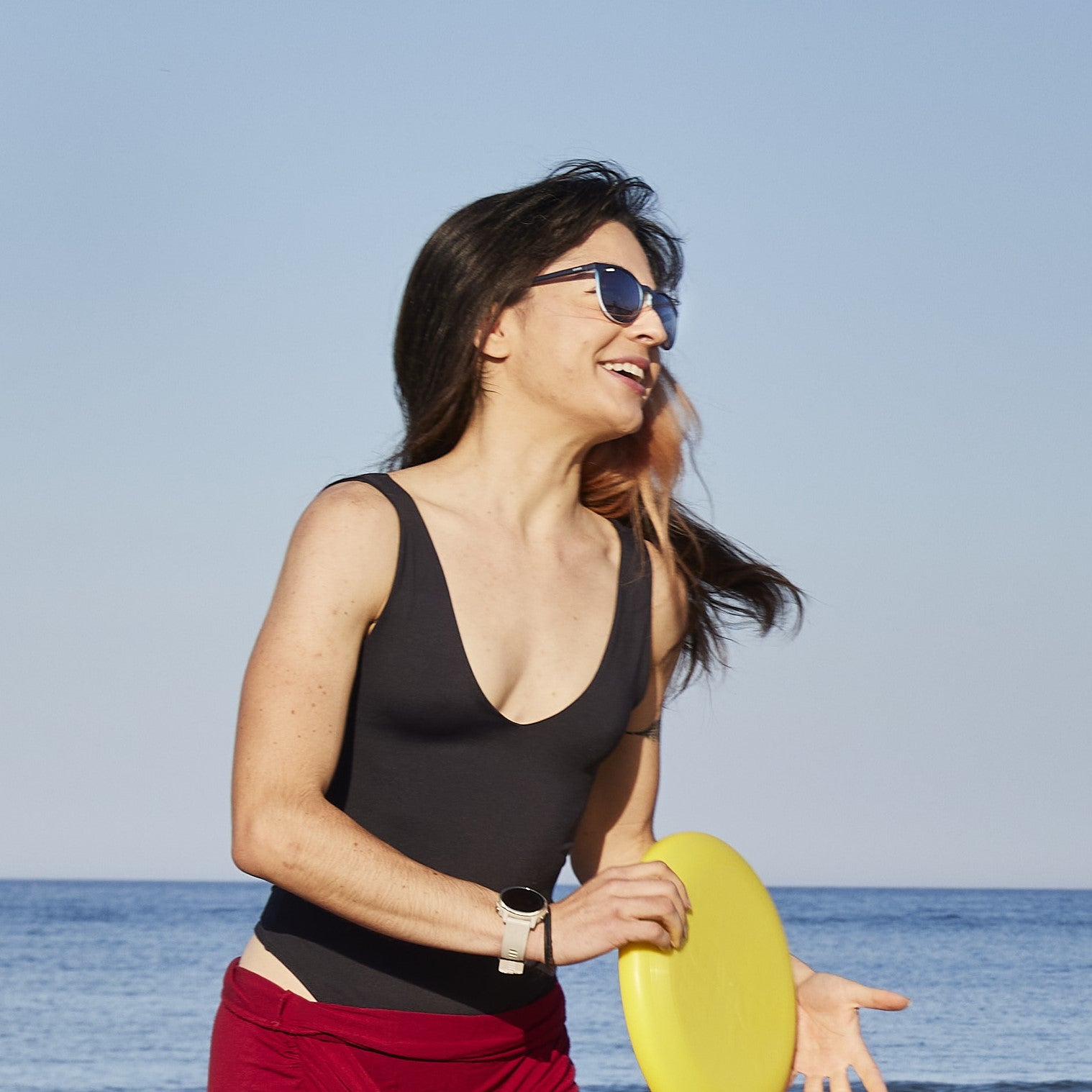 woman with sunglasses smiling